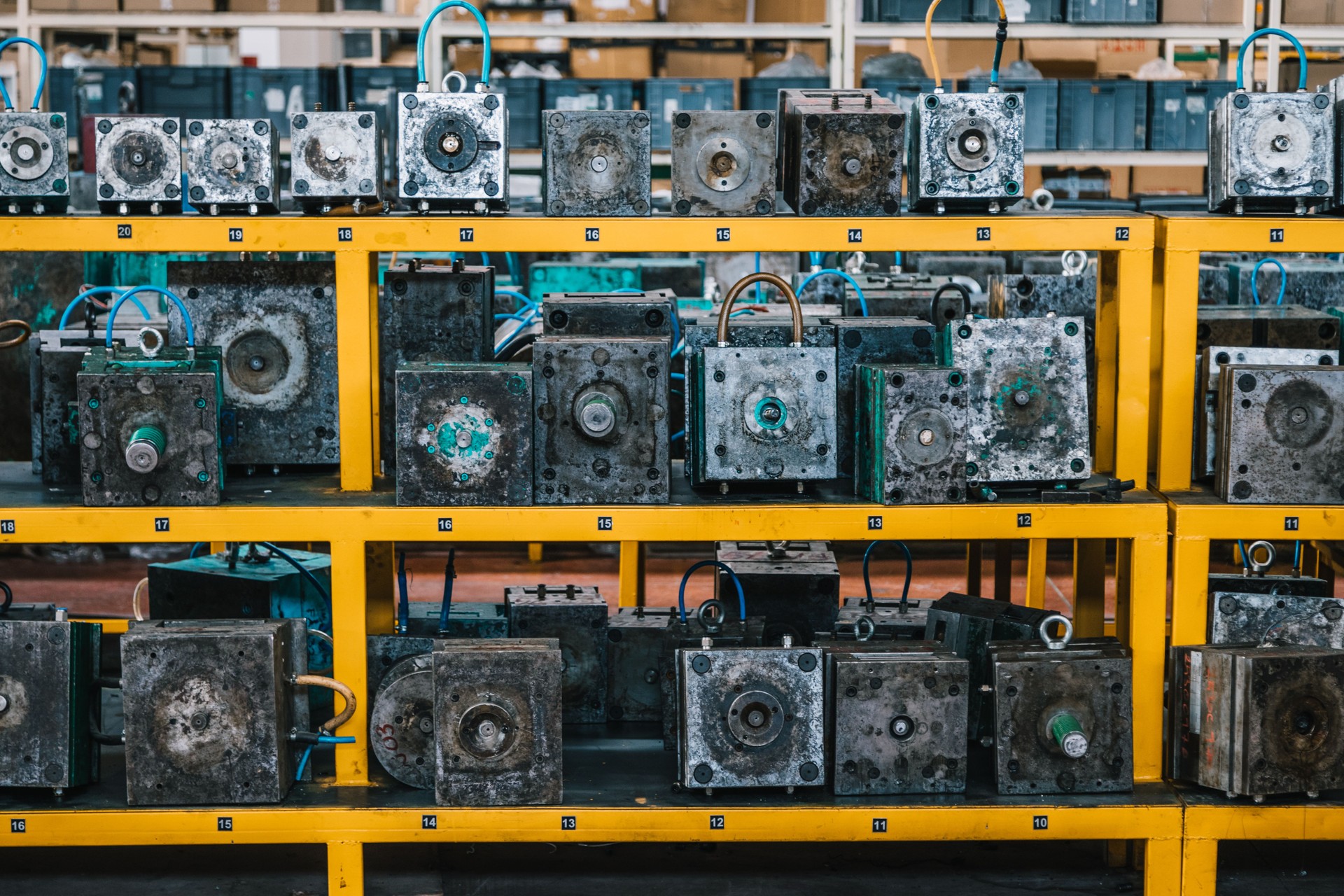 Row of molds in shelves in factory