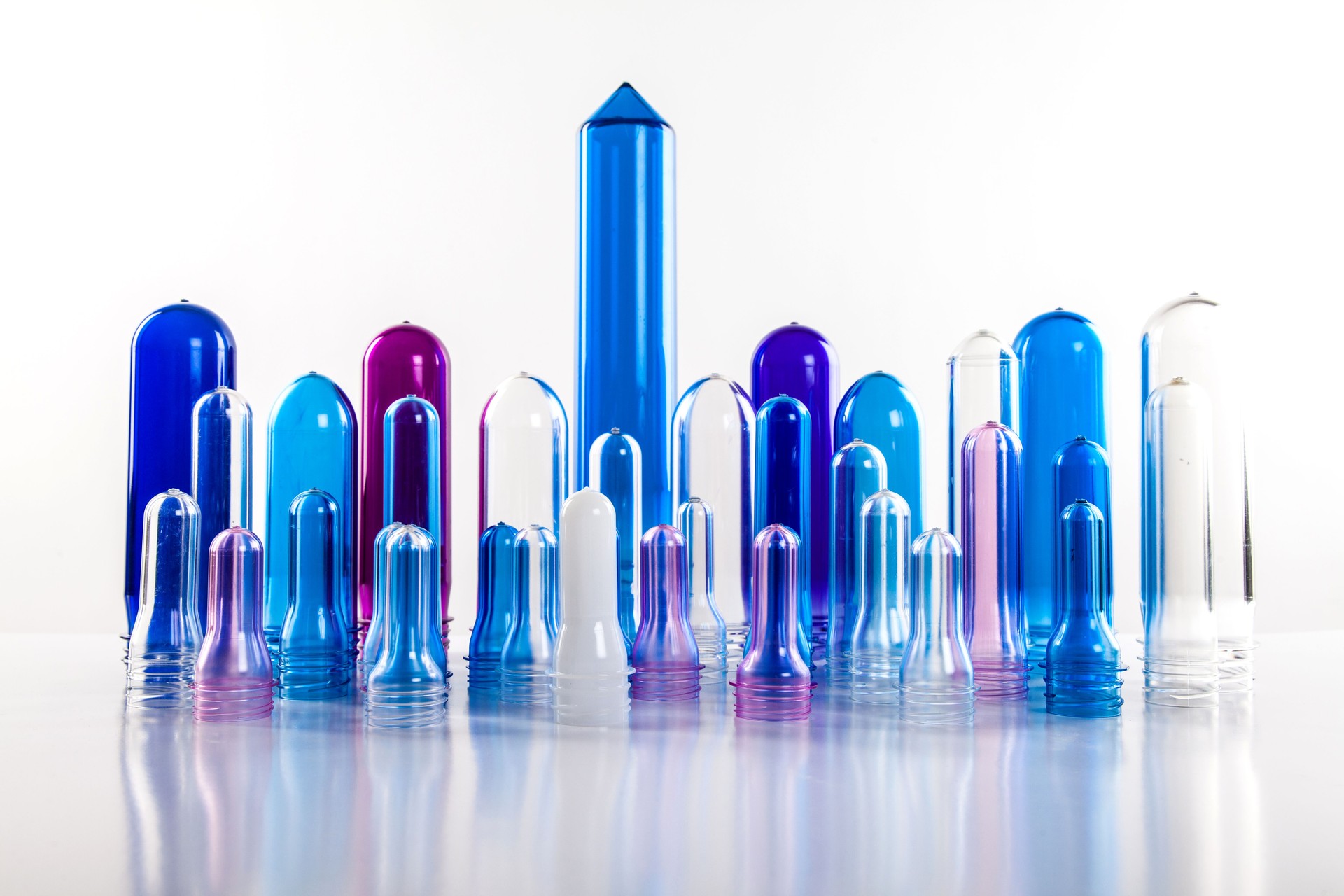 The various type of plastic bottle product and preform material with white background